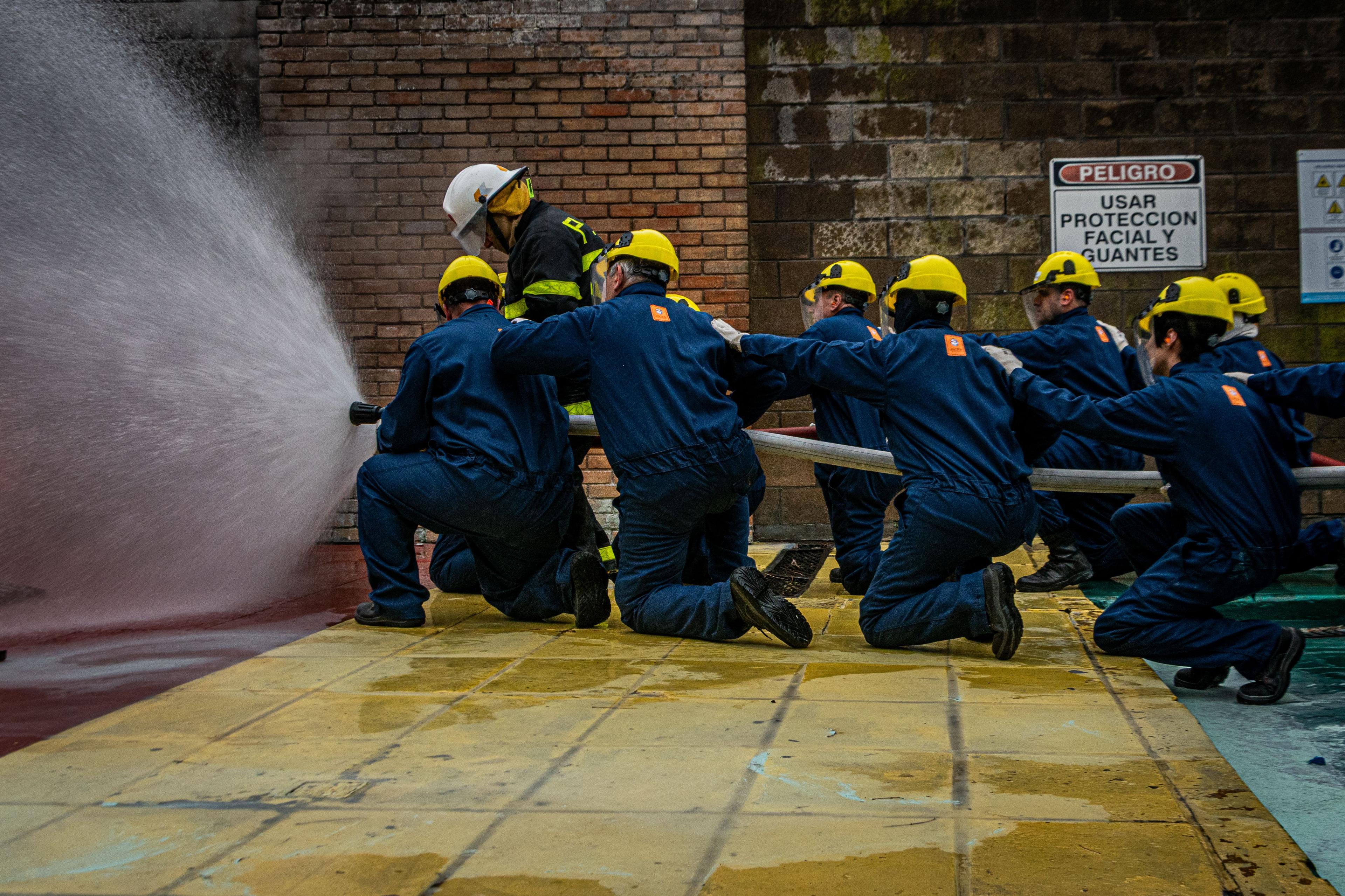 A workplace trainer leading a practical session with a small group of employees